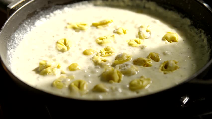 White Creamy Sauce For Pasta. Cooking Cheese Italian Food. White Yogurt Sauce. Mediterranean Cuisine. Bechamel Sauce. Homemade Boiling Tasty Spaghetti Topping. Traditional Recipe Italian White Sauce
