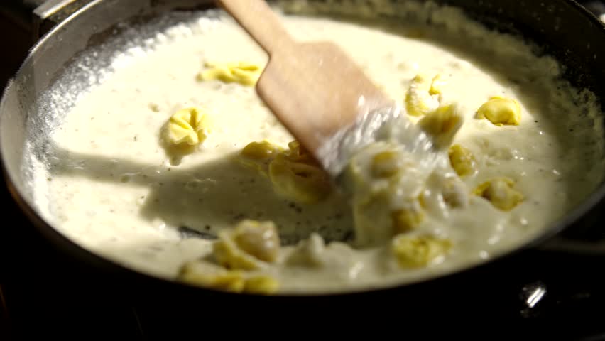 White Creamy Sauce For Pasta. Cooking Cheese Italian Food. White Yogurt Sauce. Mediterranean Cuisine. Bechamel Sauce. Homemade Boiling Tasty Spaghetti Topping. Traditional Recipe Italian White Sauce