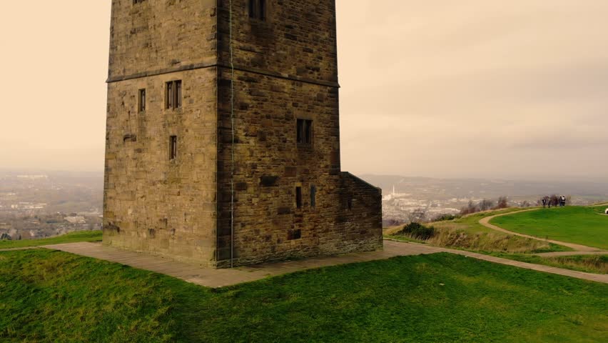 Castle Hill tower in Huddersfield wide drone aerial zoom shot selective focus