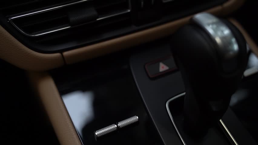 The luxury car interior boasts plush leather seats, polished wood trim, and ambient lighting. A spacious, ergonomic layout with advanced tech features creates an elegant and comfortable driving enviro