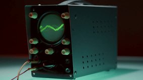 Retro oscilloscope with sharp, jagged green waveform on its CRT screen, surrounded by multiple knobs, displaying high-energy signal in neon-lit room - Powered by Shutterstock - Get 15% off with code: PIKWIZARD15