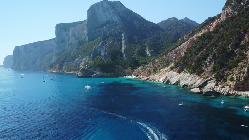 Beautiful coastline in italian island. Cala Goloritze, Sardinia. Aerial dolly out footage.