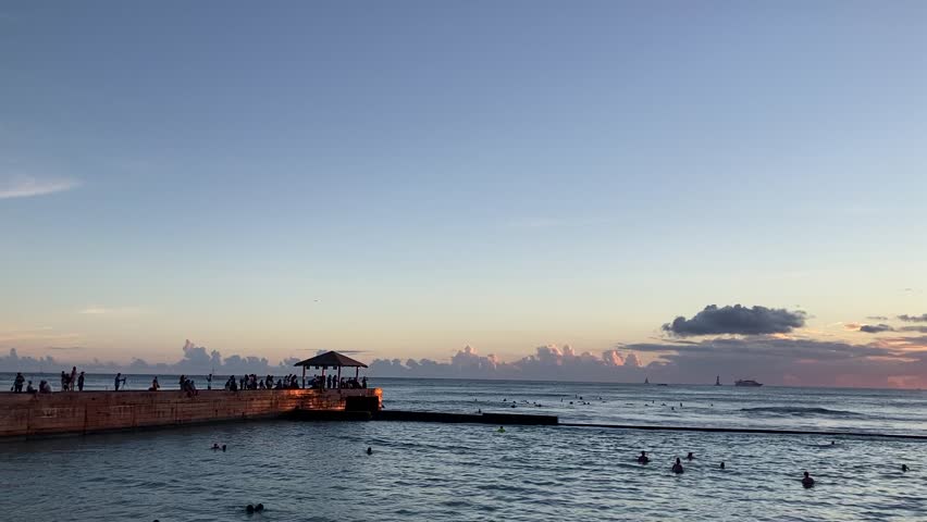 Golden sunset over Kuhio Beach Park in Hawaii