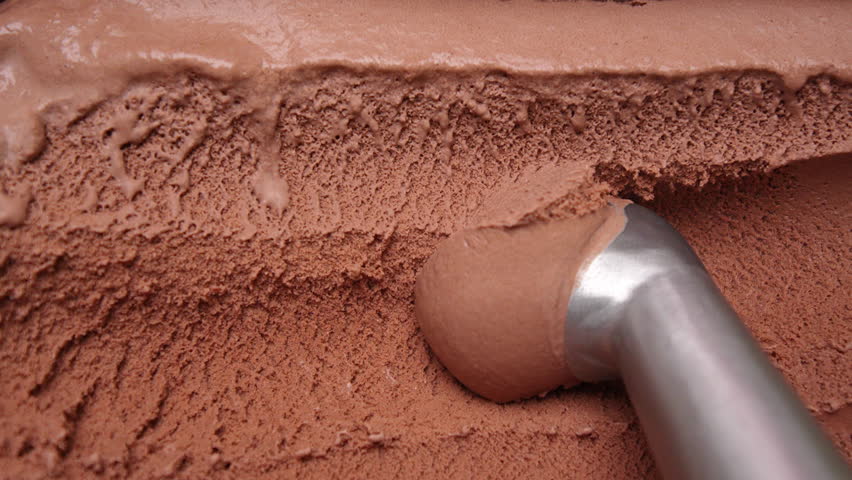 4K footage Top view Close-up Scoop of chocolate ice cream with a metal ice cream scooper.