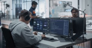 Innovative Team of Developers, Including a Focused Middle Aged Caucasian Male, Collaborate on a Project in a Modern Glass Office. Colleagues Creating Digital Solutions in a Creative Environment - Powered by Shutterstock - Get 15% off with code: PIKWIZARD15