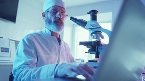 A chemist conducts experiments and analyzes samples under neon lights in a state-of-the-art research laboratory. - Powered by Shutterstock - Get 15% off with code: PIKWIZARD15