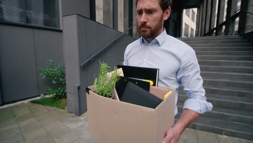 Stressed business man walking in city leave office work lost bankruptcy financial crisis dismissed job male sad Caucasian businessman unemployment middle-aged fired guy in city carry dismissal box