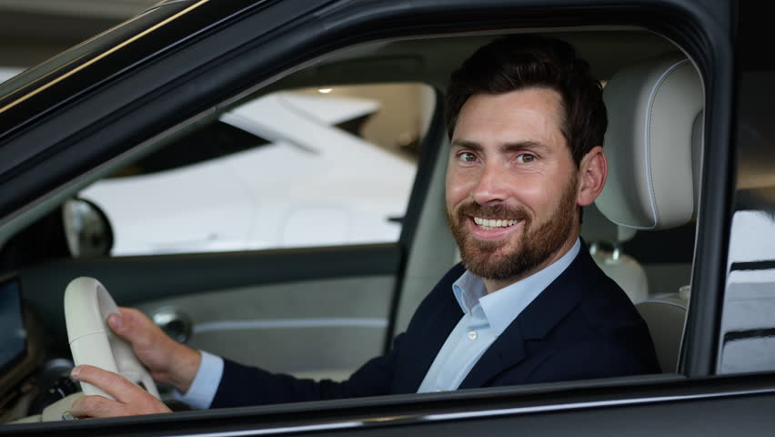Happy successful Caucasian man businessman male driver automobile guy smile looking at camera owner auto buy new car transport vehicle rent service business dealership buyer enjoy purchase test drive