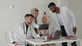 Nurse, doctor and advice in hospital for healthcare analysis, diversity and test results on x-ray scan. Medical team, men and women in discussion for digital planning, help or collaboration at clinic - Powered by Shutterstock - Get 15% off with code: PIKWIZARD15