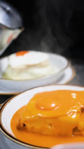 preparing tradicional Oporto dish called "francesinha" in north of Portugal