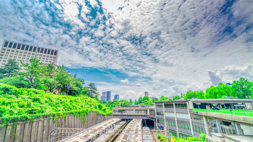 
Tokyo Yotsuya Station time lapse flowing clouds