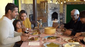 Happy multi generational latin family enjoy lunch outdoor at house terrace - Grandparents, parents and children laughing - Powered by Shutterstock - Get 15% off with code: PIKWIZARD15