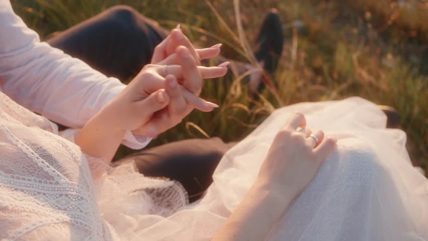 Intimate Moment A Lovely Couple Holding Hands in Nature Surrounded by Beautiful Scenery