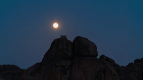 Timelapse of full moon rising over volcanic boulder in Alabama Hills, California, USA - Powered by Shutterstock - Get 15% off with code: PIKWIZARD15