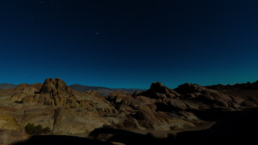 Timelapse transition from night to day over Alabama Hills in California, USA