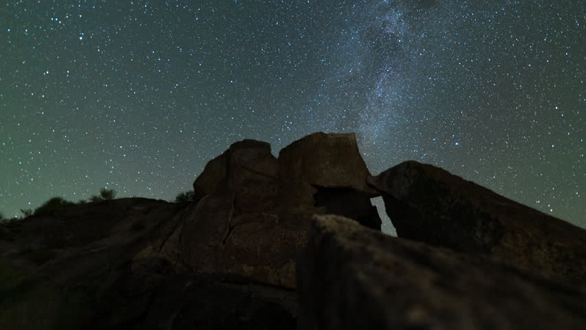 Timelapse tracking of Milky Way galaxy over Native American petroglyphs in Eastern Sierra, California