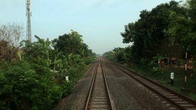 The train travels along the train tracks to the next station - Powered by Shutterstock - Get 15% off with code: PIKWIZARD15