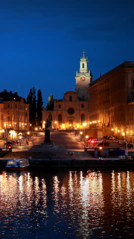 Stockholm, Sweden. Scenic Night View Of Embankment In Old Town Of Stockholm At Summer. Gamla Stan In Summer Evening. Famous Popular Destination Scenic Place And UNESCO World Heritage Site.