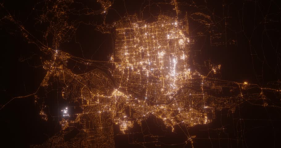 Albuquerque (New Mexico, USA) aerial view at night. Top view on modern city with street lights. Camera is zooming out, rotating counterclockwise. Vertical video. The north is on the left side