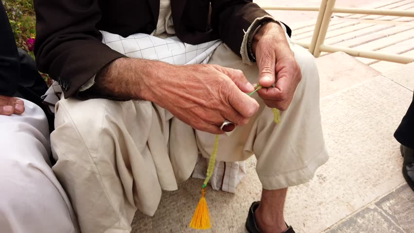 Iranian Muslim Man Manipulates Prayer Beads