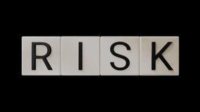 Four dice with the words RICH and RISK alternating. Illustrating the idea that to win you have to take risks. - Powered by Shutterstock - Get 15% off with code: PIKWIZARD15