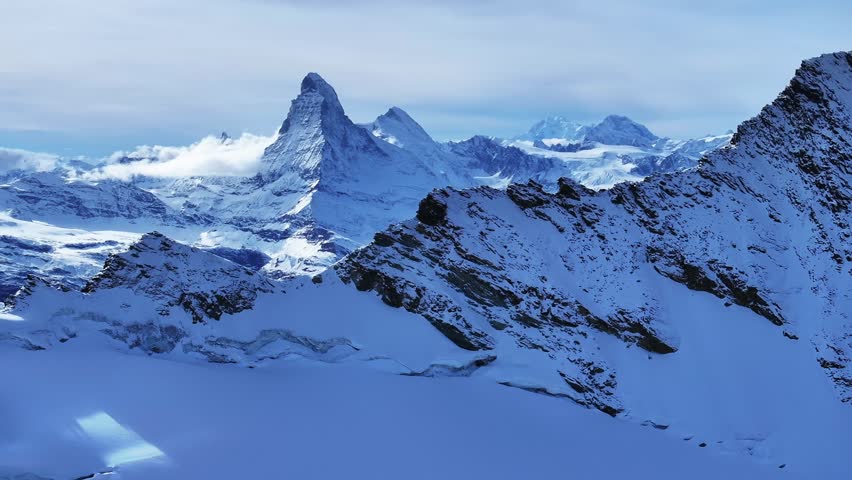Matterhorn Zermatt Saas Fee Saastal Swiss Alps aerial drone glacier circle left ski tracks mountain peaks glacial glacier crevasse autumn fresh snow vista scenic landscape Gornergrat railway blue sky