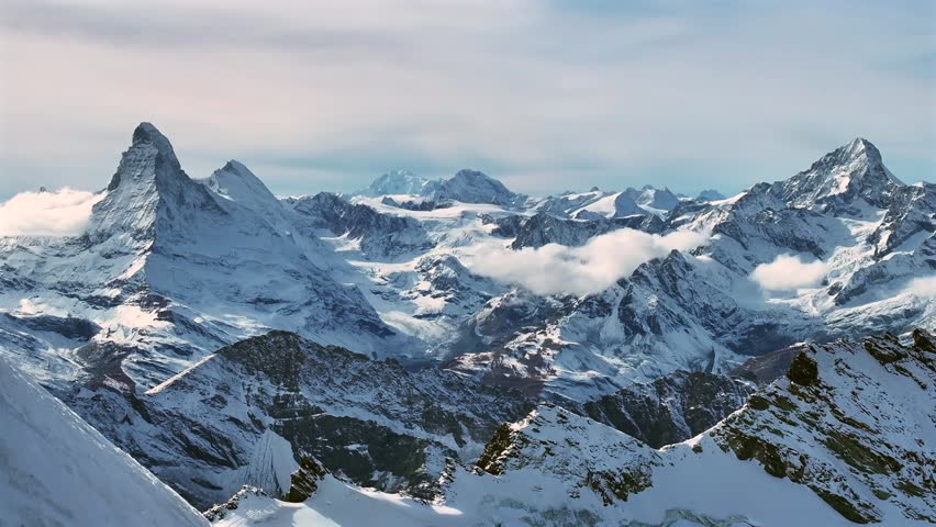 Matterhorn Zermatt Saas Fee Saastal Swiss Alps aerial drone glacier forward morion mountain peaks glacial glacier crevasse autumn fresh snow unique vista scenic landscape Gornergrat railway blue sky