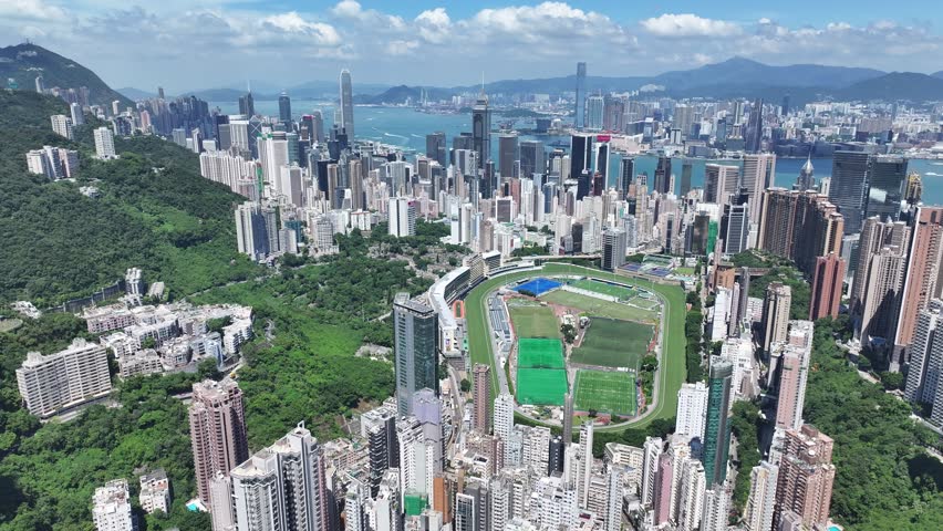 Aerial skyview of Hong Kong West Kowloon Victoria Harbour Financial Tsim Sha Tsui Hung Hom Central Admiralty Wan Chai Happy Valley Wong Nai Chung Causeway Bay Tin Hau Tai Han