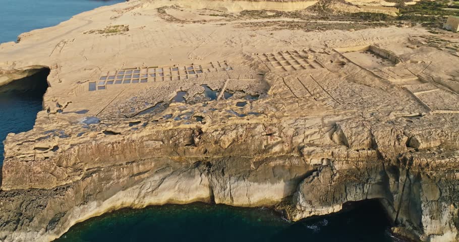 Aerial view salt plants Zebbug Island of Gozo Malta. Beautiful nature landscape of an abandoned salt mine on the shore of the Mediterranean Sea. High quality 4k footage
