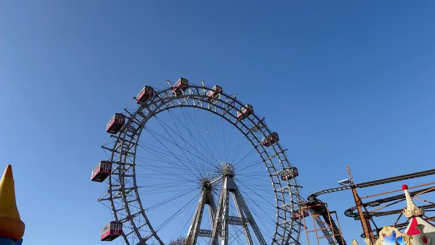 Close up of vintage ferries wheel in Vienna. Fair Amusement activities and during weekend. Children's amusement park. Giant Wheel ride