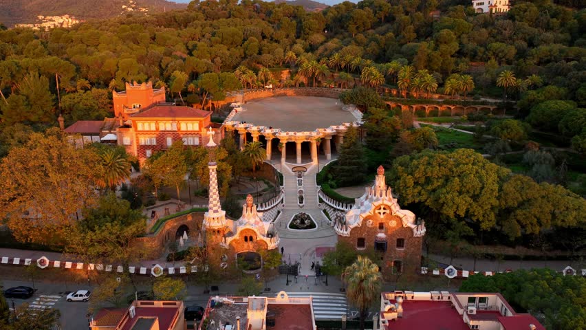 Aerial drone view of Park Guell in the morning, tourist destination in Barcelona. Antonio Gaudi architecture. Sunrise in Barcelona park Guell, Spain