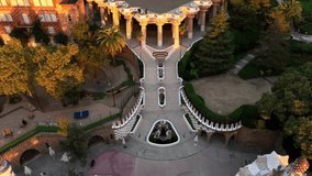 Famous Barcelona tourist spot Park Guell, aerial shot at sunrise, tourism in Barcelona. Antonio Gaudi architecture. Dawn in Barcelona park Guell, Spain. High quality 4k footage - Powered by Shutterstock - Get 15% off with code: PIKWIZARD15