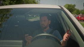 Male car owner inside automobile driving city roadway using mobile phone gps Caucasian man driver guy businessman drive modern electric auto confused upset smartphone navigation error problem travel - Powered by Shutterstock - Get 15% off with code: PIKWIZARD15