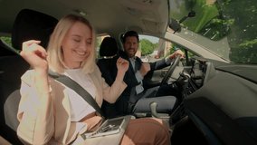 Caucasian woman man husband wife male female business couple travel together auto drive road city listen music radio in car driving happy carefree girl guy dance sing inside automobile rent transport - Powered by Shutterstock - Get 15% off with code: PIKWIZARD15