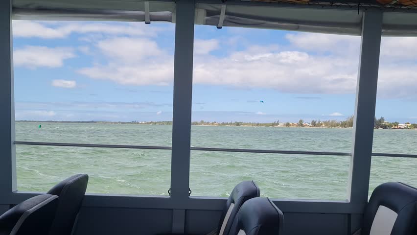 Ferry Boat Araruama Praia Seca (Dry Beach) - Crossing Araruama Lagoon, Brazil, natural beauty over calm waters.  Peaceful ride through serene landscapes, relaxing vacation in Região dos Lagos.
