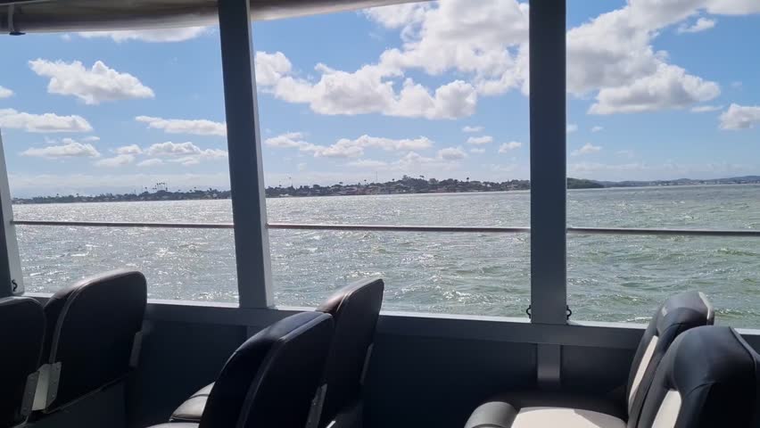 Ferry Boat Araruama Praia Seca (Dry Beach) - Crossing Araruama Lagoon, Brazil, natural beauty over calm waters.  Peaceful ride through serene landscapes, relaxing vacation in Região dos Lagos.