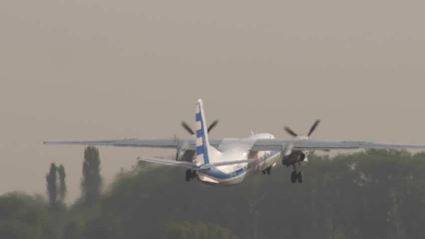 Turboprop plane takeoff at Almaty airport. Airplane departure. Travel concept