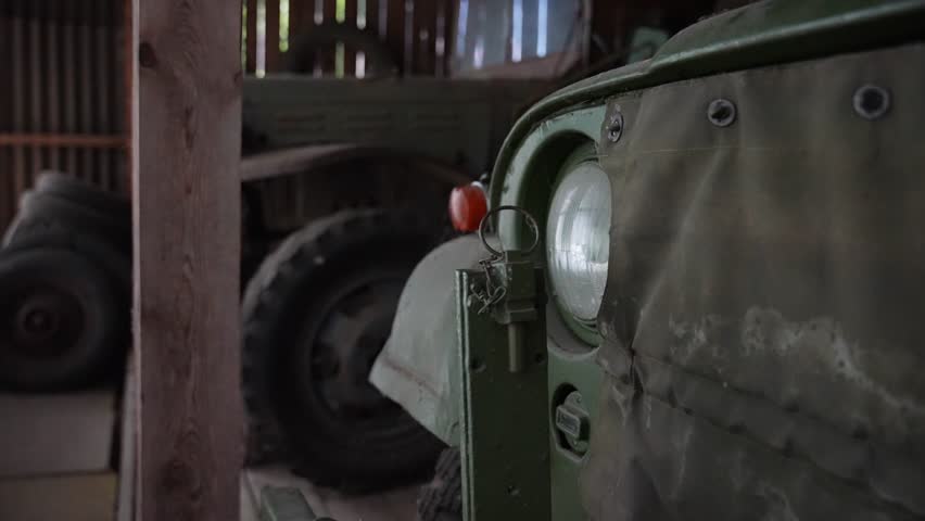 old army jeep in a garage
