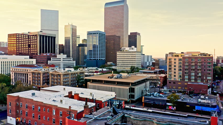 Aerial view of Colorado Capitol and Denver, Colorado skyline at sunset with slow lateral panning. Denver is the capital, and most populous city of the US state of Colorado