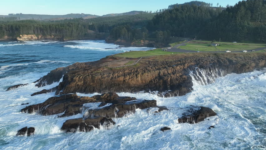 The Pacific Ocean crashes against the rocky and rugged coast of Rocky Creek, Oregon, south of Lincoln City. This part of the Pacific Northwest coast is incredibly scenic and accessed from highway 101.