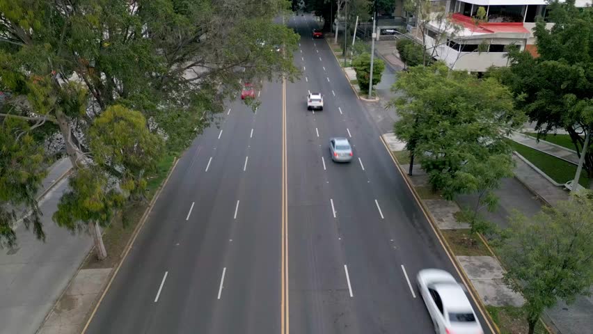 Aerial static shot from a drone showing Vallarta Avenue in Guadalajara facing south, capturing city traffic and urban landscape.