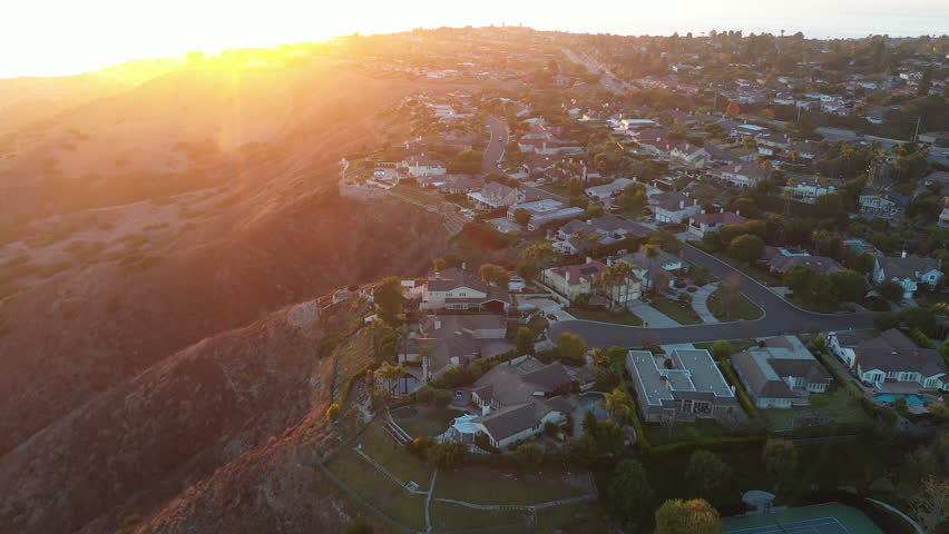 Sunset view of the Portuguese Bend neighborhood of Rancho Palos Verdes, California, USA, where landslides are eroding the slopes.