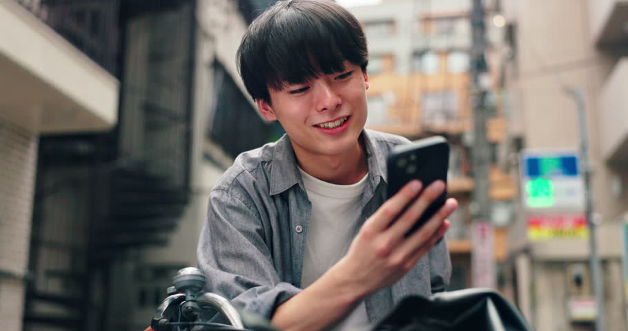 Smile, typing and Asian man in city with smartphone, contact and thinking on morning commute. Urban street, connection and Japanese university student with phone, search or mobile app for online chat