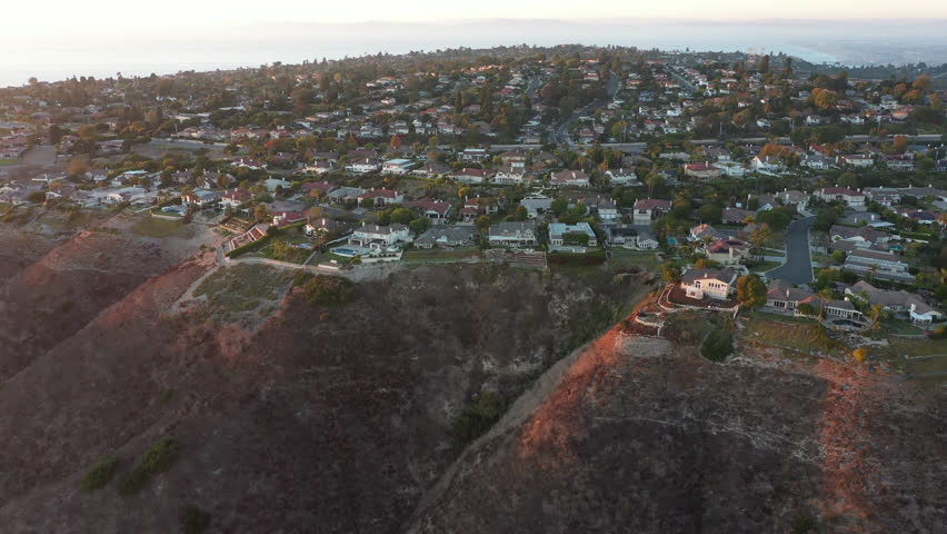 Sunset view of the Portuguese Bend neighborhood of Rancho Palos Verdes, California, USA, where landslides are eroding the slopes.