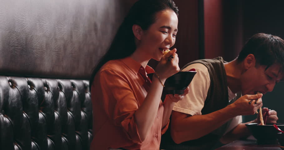 Restaurant, lunch and couple eating ramen together for romantic date, bonding and relax at table. Love, man and woman at noodle cafe for Japanese food, culture and weekend diet with dinner service