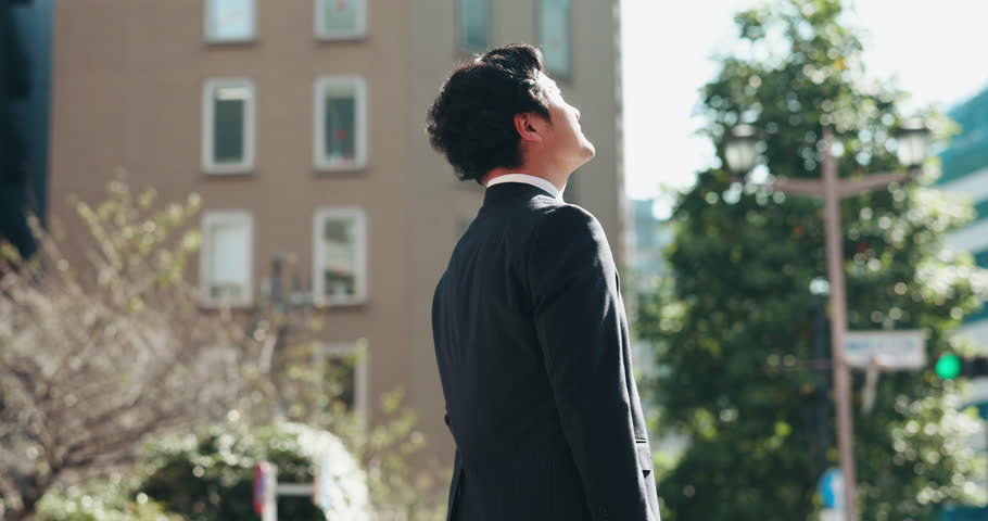 Thinking, architecture and Asian business man in city for morning commute, travel and journey. Professional, urban planning and Japanese person in town with inspiration for career, job and buildings