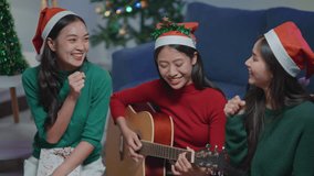 Family and friends decorate on the Christmas tree together with happy and joyful. - Powered by Shutterstock - Get 15% off with code: PIKWIZARD15