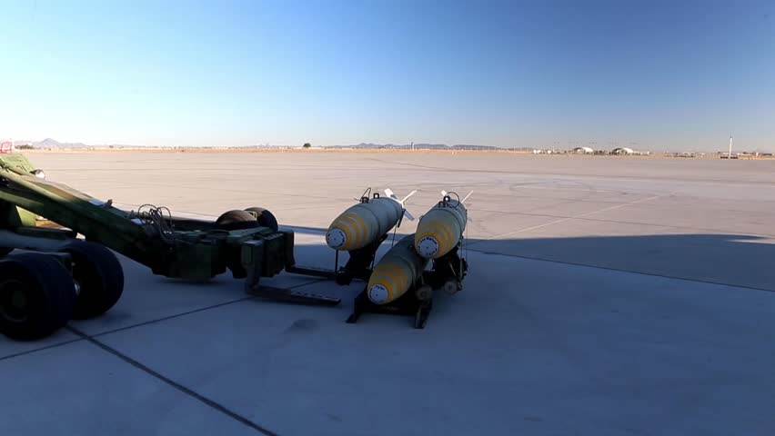 AV-8B Harrier II loading weapons.
