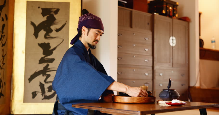 Man, tea ceremony and calm with matcha mix for process at Japanese tradition with culture, wellness and tools. Bowl, ceramic and brush for traditional detox, health and green drink custom in home