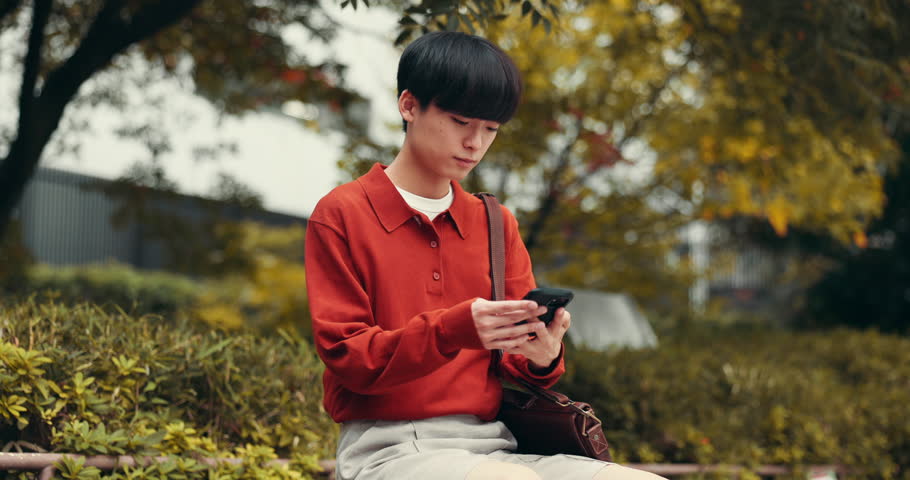 Asian man, smile and peace sign in park for selfie, social media update and follower engagement in Japan. Student, influencer or happy in Tokyo for live stream, photography or picture for travel blog